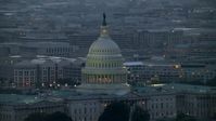 4.8K stock footage aerial video of the United States Capitol dome, office buildings in background, Washington, D.C., twilight Aerial Stock Footage | AX76_168E