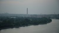 4.8K stock footage aerial video of the Washington Monument seen from East Potomac Park in Washington, D.C., twilight Aerial Stock Footage | AX76_176