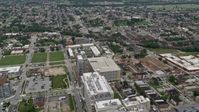 4.8K stock footage aerial video flying over Johns Hopkins Hospital buildings to approach urban neighborhoods in Baltimore, Maryland Aerial Stock Footage | AX78_117E