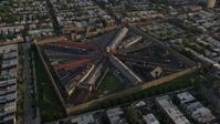 4.8K stock footage aerial video flying by Eastern State Penitentiary in Philadelphia, Pennsylvania at Sunset Aerial Stock Footage | AX80_051