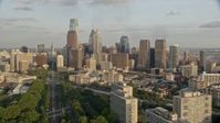 4.8K stock footage aerial video approaching Philadelphia City Hall and skyscrapers in Downtown Philadelphia, Pennsylvania, Sunset Aerial Stock Footage | AX80_056