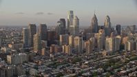 4.8K stock footage aerial video of Downtown Philadelphia skyscrapers and urban neighborhoods in Pennsylvania, Sunset Aerial Stock Footage | AX80_092E