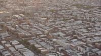 4.8K stock footage aerial video flying by an urban neighborhood in South Philadelphia and tilt to the busy street, Pennsylvania, Sunset Aerial Stock Footage | AX80_111