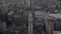 4.8K stock footage aerial video approaching Philadelphia City Hall's William Penn statue, Downtown Philadelphia, Pennsylvania, Sunset Aerial Stock Footage | AX80_115E