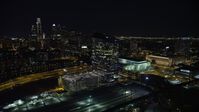 4.8K stock footage aerial video of orbit bridges over the Schuylkill River by Cira Centre, I-76 and train yard, reveal Downtown Philadelphia, Pennsylvania, Night Aerial Stock Footage | AX81_050E