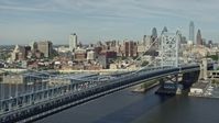 4.8K stock footage aerial video panning across Benjamin Franklin Bridge to reveal Downtown Philadelphia skyline, Pennsylvania Aerial Stock Footage | AX82_003E