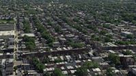 4.8K stock footage aerial video flying by row houses in an urban neighborhood in North Philadelphia, Pennsylvania Aerial Stock Footage | AX82_021