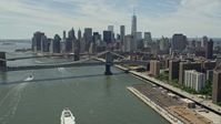 4.8K stock footage aerial video of Brooklyn and Manhattan Bridges, and the Lower Manhattan skyline, New York City Aerial Stock Footage | AX83_182