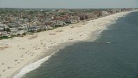 4.8K stock footage aerial video flying by beachfront condominiums, Long Beach, New York Aerial Stock Footage | AX83_238E