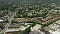 4.8K stock footage aerial video flying by suburban neighborhoods to reveal warehouses, Republic Airport in Farmingdale, New York Aerial Stock Footage | AX83_265E