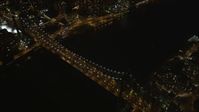 4K stock footage aerial video Fly by Queensboro Bridge, reveal Midtown Manhattan, New York, New York, night Aerial Stock Footage | AX85_101
