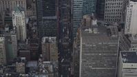 4K stock footage aerial video Tilt up from 7th Avenue, revealing Times Square, Midtown Manhattan, New York Aerial Stock Footage | AX87_115