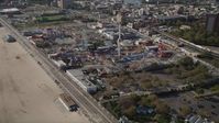 4K stock footage aerial video of flying by Luna Park rides in Coney Island, Brooklyn, New York City, New York Aerial Stock Footage | AX88_045