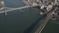 4K stock footage aerial video pan from Manhattan Bridge to famous Brooklyn Bridge, East River, New York, New York Aerial Stock Footage | AX88_121