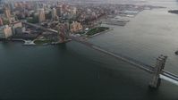 4K stock footage aerial video Flying by Brooklyn Bridge, East River, New York, New York, sunset Aerial Stock Footage | AX89_009