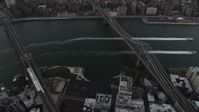 4K stock footage aerial video Flying by Brooklyn Bridge, Manhattan Bridge, East River, New York, twilight Aerial Stock Footage | AX89_033