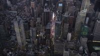 4K stock footage aerial video Approaching Times Square, Midtown Manhattan, tilt down, New York, twilight Aerial Stock Footage | AX89_083