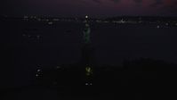 4K stock footage aerial video Flying by Statue of Liberty, Liberty Island, New York, New York, twilight Aerial Stock Footage | AX89_137