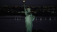 4K stock footage aerial video Flying by Statue of Liberty, Liberty Island, New York, New York, night Aerial Stock Footage | AX89_140