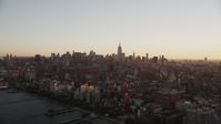 4K stock footage aerial video Flying by Midtown Manhattan skyline, Hudson River, New York, New York, sunrise Aerial Stock Footage | AX90_026