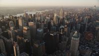4K stock footage aerial video Flying by Midtown Manhattan, Empire State Building, New York, sunrise Aerial Stock Footage | AX90_046