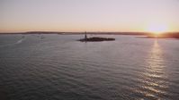 4K stock footage aerial video Approaching the Statue of Liberty, New York, New York, sunset Aerial Stock Footage | AX93_105