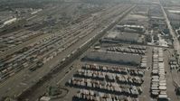 HD stock footage aerial video flyby rows of shipping containers at a train yard in Vernon, California Aerial Stock Footage | CAP_004_025