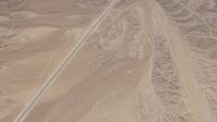 HD stock footage aerial video of bird's eye view of a highway through open desert in San Bernardino County, California Aerial Stock Footage | CAP_006_012
