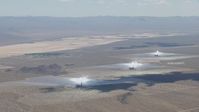 HD stock footage aerial video of passing the Ivanpah Solar Electric Generating System in California with cloud shadow on the arrays Aerial Stock Footage | CAP_006_035