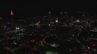 HD stock footage aerial video of flying past city buildings and skyscrapers at night, Downtown Atlanta, Georgia Aerial Stock Footage | CAP_013_024