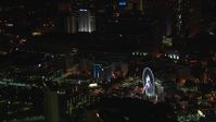 HD stock footage aerial video of orbiting city buildings and Ferris wheel at night, Downtown Atlanta, Georgia Aerial Stock Footage | CAP_013_027