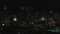 HD stock footage aerial video of a reverse view of the city's downtown skyline at night, Downtown Atlanta, Georgia Aerial Stock Footage | CAP_013_115