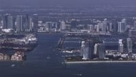 HD stock footage aerial video of flying by South Beach high-rises with view of downtown skyline, Miami, Florida Aerial Stock Footage | CAP_020_023