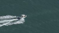 HD stock footage aerial video of tracking a boat racing across the water near Miami, Florida Aerial Stock Footage | CAP_020_036