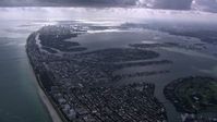 HD stock footage aerial video of flying over Miami Beach toward Biscayne Bay and Downtown Miami, Florida Aerial Stock Footage | CAP_020_059