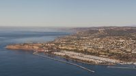 HD stock footage aerial video of flying toward the harbor and coastal neighborhoods in Dana Point, California Aerial Stock Footage | CAP_021_060