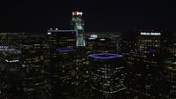 5K stock footage aerial video flying through Downtown Los Angeles skyscrapers at night, California Aerial Stock Footage | DCA01_031