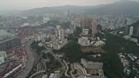 4K stock footage aerial video pan from Port of Hong Kong and office buildings to reveal Kwai Chung apartment buildings, Hong Kong, China Aerial Stock Footage | DCA02_018