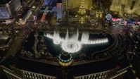 4K stock footage aerial video of flying over The Bellagio with Paris in background, tilting to the water show, Las Vegas, Nevada Night Aerial Stock Footage | DCA03_023