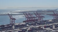 4K stock footage aerial video flyby containers, cranes, cargo ship at Port of Long Beach, California Aerial Stock Footage | DCA06_040