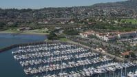 4K stock footage aerial video of flying by a hotel and a marina full of boats in San Pedro, California Aerial Stock Footage | DCA06_046
