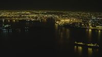 4K stock footage aerial video of flying by the Port of Long Beach, Long Beach, California, night Aerial Stock Footage | DCA07_150