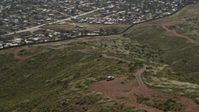 4K stock footage aerial video orbit Border Patrol and tilt to reveal Tijuana homes, US/Mexico Border, Tijuana Aerial Stock Footage | DCA08_076
