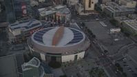 5K stock footage aerial video tilt from Staples Center to reveal Downtown Los Angeles at sunset, California Aerial Stock Footage | DCLA_041