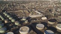 5K stock footage aerial video pan across oil refinery tanks and buildings in El Segundo, California Aerial Stock Footage | DCLA_194