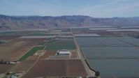5K stock footage aerial video Fly by geometric fields of farmland, Sierra Madre Mountains, Santa Maria, California Aerial Stock Footage | DCSF02_001