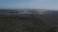 5K stock footage aerial video Tilt from Pismo Dunes, reveal Phillips 66 Company Santa Maria Refinery, Arroyo Grande, California Aerial Stock Footage | DCSF02_004