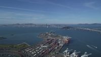 5K stock footage aerial video Fly over the Port of Oakland to approach the Bay Bridge and San Francisco Bay, California Aerial Stock Footage | DCSF05_005