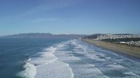5K stock footage aerial video Waves crashing near Ocean Beach, Outer Sunset District, California Aerial Stock Footage | DCSF05_055