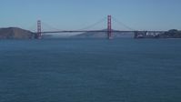 5K stock footage aerial video Tilt from San Francisco Bay, reveal Golden Gate Bridge, San Francisco, California Aerial Stock Footage | DCSF05_060